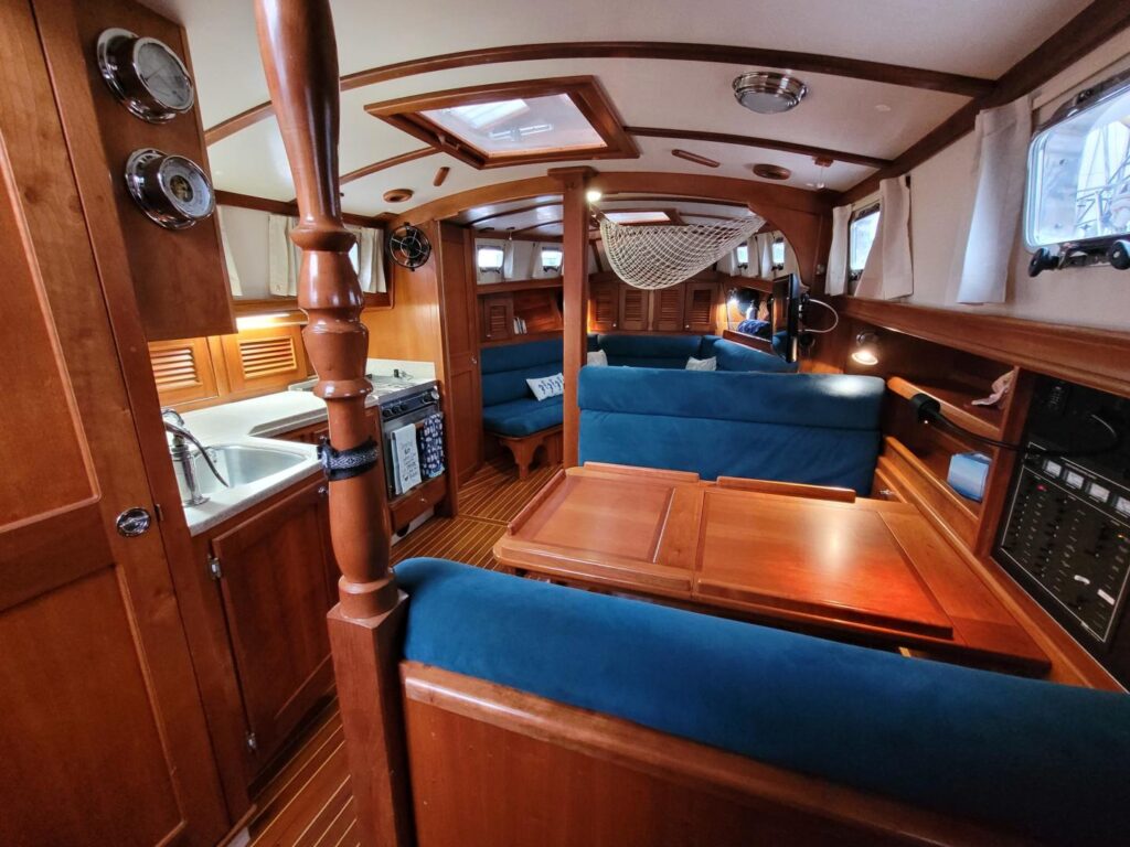 Festina Lente's salon and galley, as viewed from the starboard quarter, demonstrating the open space afforded by the convertible v-berth.